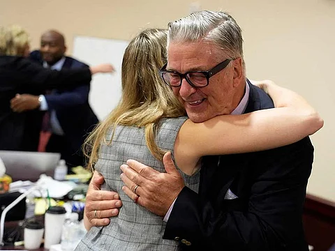 File photo:  US actor Alec Baldwin hugs a member of his legal team at the conclucion of his trial on involuntary manslaughter at Santa Fe County District Court in Santa Fe, New Mexico, on July 12, 2024. 