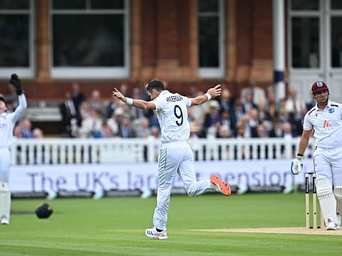England's James Anderson celebrates after the dismissal of West Indies Joshua Da Silva caught behind by England's wicketkeeper Jamie Smith during play on the third day of the first Test cricket match at Lord's Cricket Ground in London on July 12.