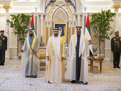 His Highness Sheikh Mohamed bin Zayed Al Nahyan, President of the United Arab Emirates (2nd R) and His Highness Sheikh Mohamed bin Rashid Al Maktoum, UAE Vice President, Prime Minister and Ruler of Dubai (4th R), stand for a photograph with Sheikh Hamdan bin Mohamed bin Rashid Al Maktoum, Crown Prince of Dubai, UAE Deputy Prime Minister and Minister of Defence (3rd R), during a swearing-in ceremony for newly appointed UAE Cabinet Ministers, at Qasr Al Watan.