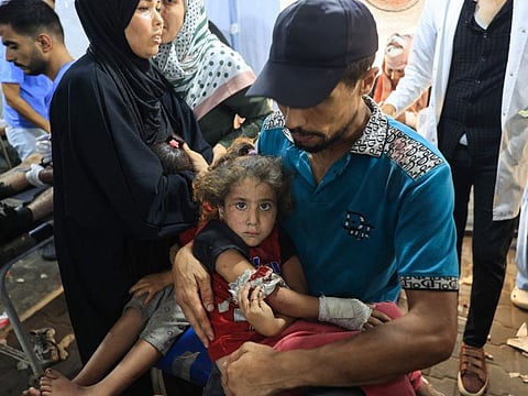 A wounded Palestinian girl is brought to be treated at the Al Awda Hospital in Nuseirat refugee Camp after the Israeli military bombardment of the UNRWA (United Nations Relief and Works Agency for Palestine Refugees) run Abu Araban school, turned shelter, where internally displaced Palestinians are living, in the Nuseirat camp, in the central Gaza Strip on July 14, 2024.