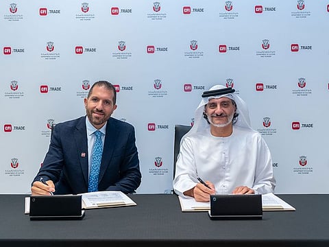 Hisham Mansour (left), Co-founder and Managing Director of CFI, and H.E. Saleh Mohammed Al Geziry, Director General for Tourism at DCT Abu Dhabi sign the partnership agreement