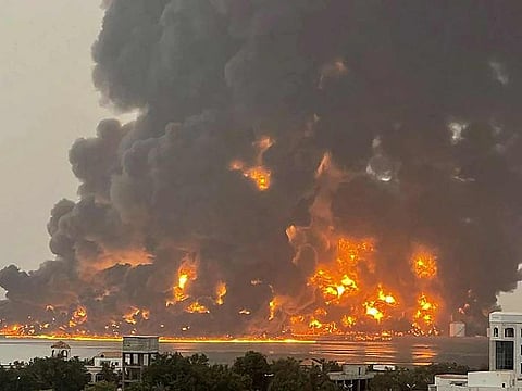 A handout picture obtained from Yemen's Houthis Ansarullah Media Centre shows a huge column of fire erupting following reported Israeli strikes in the Yemeni rebel-held port city of Hodeida on July 20, 2024. 