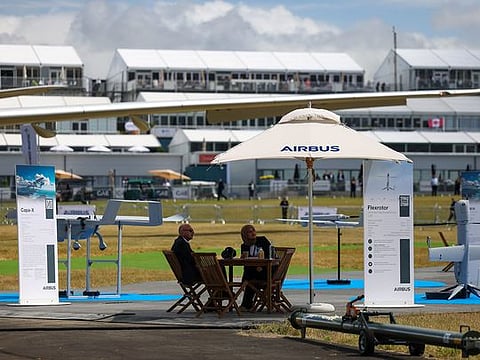 Attendees at the Airbus SE Unmanned Air Systems (UAS) static display during the opening day of the Farnborough International Airshow in Farnborough, UK, on Monday, July 22, 2024. The aviation summit is typically a platform for planemakers to rack up multibillion-dollar deals.