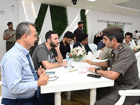 GDRFA Dubai officials engaging with the community at the 'Sure Forum'. 