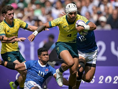 Australia's Dietrich Roache Runs with the ball during the men's pool B rugby sevens match against Samoa during the Paris 2024 Olympic Games at the Stade de France in Saint-Denis on Wednesday.