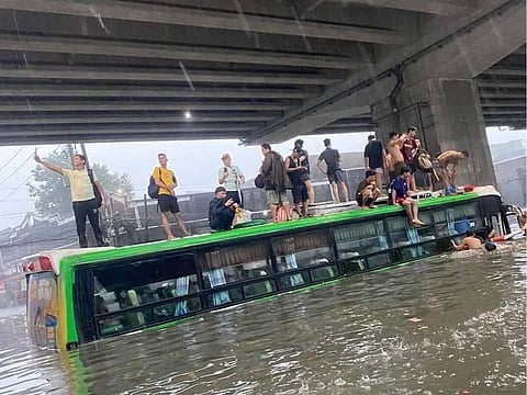 Filipina tweep Reyna Valmores shared this photo on Wednesday showing a flooded bus and people on top of it. Authorities have deployed emergency workers for search and rescue operations. Many passengers were stranded due to severe rains brought by the “Habagat” season to Metro Manila and the National Capital Region.   