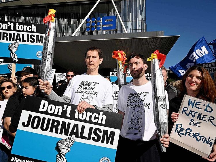 Journalists from The Age newspaper protest outside their offices in Melbourne