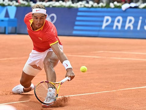 Spain's Rafael Nadal returns to Hungary's Marton Fucsovics during their men's singles first round tennis match on Court Philippe-Chatrier at the Roland-Garros Stadium at the Paris 2024 Olympic Games on Sunday.