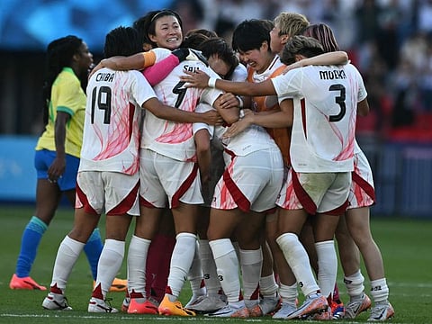 Japan's players celebrate after winning the women's group C football match against Brazil during the Paris 2024 Olympic Games at the Parc des Princes in Paris on Sunday.