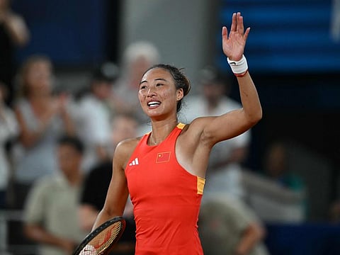 China's Zheng Qinwen reacts after beating Germany's Angelique Kerber during their women's singles quarter-final tennis match on Court Philippe-Chatrier at the Roland-Garros Stadium during the Paris 2024 Olympic Games, in Paris on Wednesday.