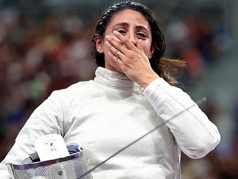 Nada Hafez of Team Egypt shows emotion after her victory against Elizabeth Tartakovsky of Team United States (not pictured) in the Fencing Women's Sabre Individual Table of 32 on day three of the Olympic Games Paris 2024 at Grand Palais on July 29, 2024 in Paris, France.
