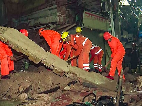  NDRF personnel conduct a rescue operation after a house collapsed following heavy rainfall at Sabzi Mandi area in New Delhi on Wednesday.