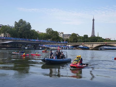 Rescuers on a jet ski wait on the River Seine during the Men's Individual Triathlon event at the Paris 2024 Olympic Games in Paris, France, on July 31.