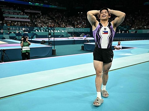 Philippines' Carlos Edriel Yulo celebrates after winning the artistic gymnastics men's vault final during the Paris 2024 Olympic Games at the Bercy Arena in Paris, on August 4, 2024. (Photo by Lionel BONAVENTURE / AFP)