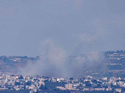 This picture taken from northern Israel shows smoke billowing during Israeli bombardment of the southern Lebanese border village of Khiam on August 6, 2024.