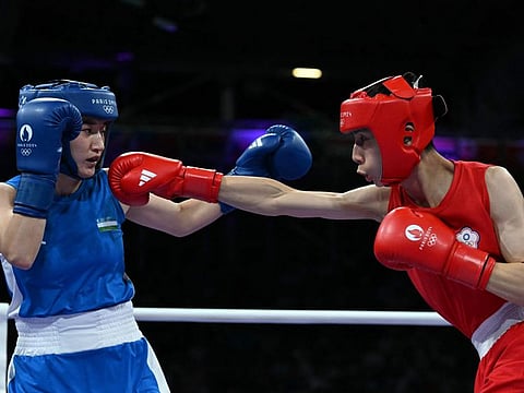 Taiwan's Lin Yu-ting (in red) fights against Uzbekistan's Sitora Turdibekova in the women's 57kg preliminaries round of 16 boxing match during the Paris 2024 Olympic Games at the North Paris Arena, in Villepinte on August 2.