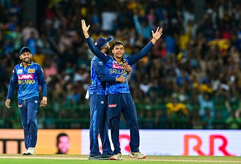Sri Lanka's Dunith Wellalage and Sadeera Samarawickrama (left) celebrate their team's win in the third and final ODI cricket match against India at the R. Premadasa International Cricket Stadium in Colombo on Wednesday.