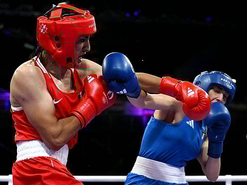 Algeria's Imane Khelif (in red) punches Italy’s Angela Carini in the women’s 66kg preliminary round of 16 boxing match during the Paris 2024 Olympic Games at the North Paris Arena, in Villepinte, on August 1, 2024. Khelif has now advanced to the final.