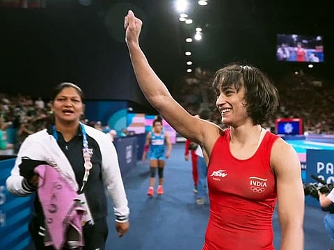 India's Vinesh Phogat, who is celebrating her victory in the women's freestyle 50kg wrestling semifinals, has been disqualified.