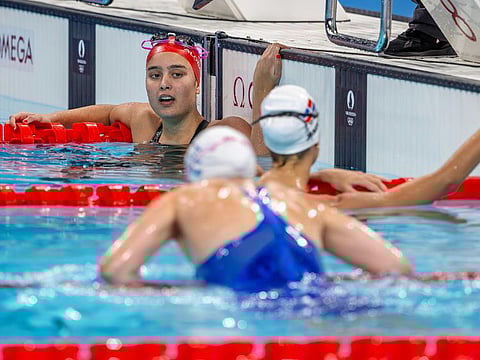 Amani Al Obaidli celebrates after clocking her personal best and Bahrain's record during 100-metre heat of the Paris Olympics.