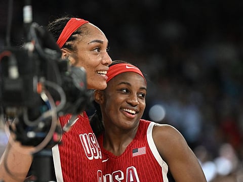 USA's A'ja Wilson (left) and Jackie Young react after winning the women's Gold Medal basketball match against France during the Paris 2024 Olympic Games at the Bercy  Arena in Paris on Sunday.
