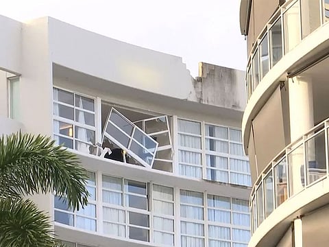  This frame grab taken from video footage provided by Australian Broadcasting Corporation (ABC) on August 12, 2024, via AFPTV shows the damage after a helicopter crashed into the roof of a Hilton hotel in Cairns on August 12, 2024, killing the pilot and igniting a blaze on the building's roof