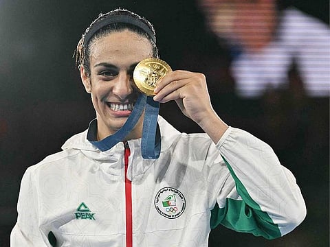 Gold medallist Algeria's Imane Khelif poses on the podium during the medal ceremony for the women's 66kg final boxing category during the Paris 2024 Olympic Games at the Roland-Garros Stadium, in Paris on August 9, 2024.