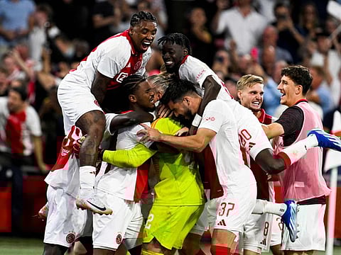 Ajax's players celebrate after winning the penalty shootout at the end of the Uefa Europa League match against Panathinaikos in Amsterdam on Thursday.