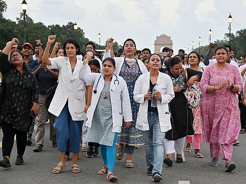 Doctors raise slogans during a protest against the alleged rape and murder of RG Kar Medical College and Hospital trainee doctor, at Kartavya Path in New Delhi. 