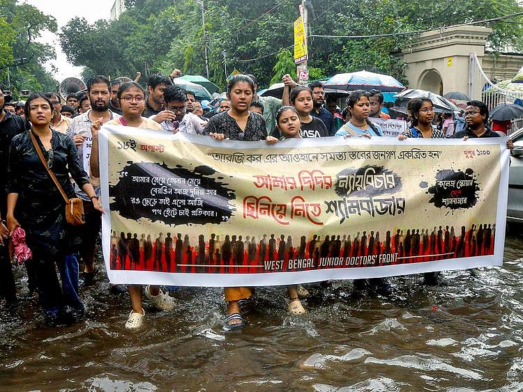 West Bengal Junior Doctors Front members stage a protest against the sexual assault and murder of a postgraduate trainee doctor at Kolkata RG Kar Hospital, in Kolkata on Sunday.  