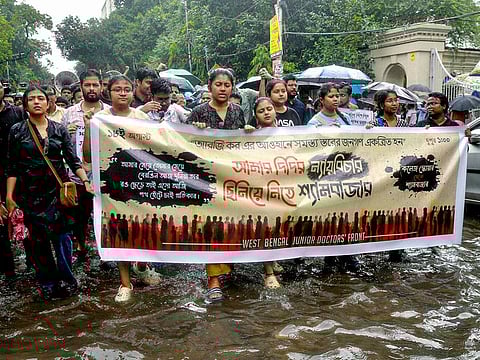 West Bengal Junior Doctors Front members stage a protest against the sexual assault and murder of a postgraduate trainee doctor at Kolkata RG Kar Hospital, in Kolkata on Sunday.  