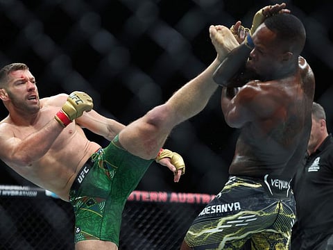 South Africa's Dricuc Du Plessis (left) and New Zealand's Israel Adesanya fight in their men's middleweight division event of the Ultimate Fighting Championship (UFC) 305 at the Perth Arena in Perth on Sunday.