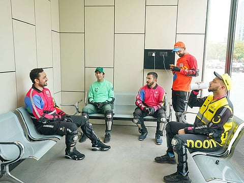 Delivery riders take a break inside one of the 20 rest areas developed for them across Dubai.