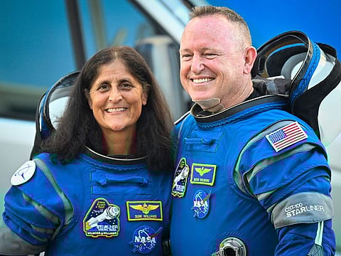 NASA astronauts Butch Wilmore (R) and Suni Williams, wearing Boeing spacesuits, depart the Neil A. Armstrong Operations and Checkout Building at Kennedy Space Center for Launch Complex 41 at Cape Canaveral Space Force Station in Florida to board the Boeing CST-100 Starliner spacecraft for the Crew Flight Test launch , on June 5, 2024. 