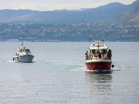 A Coast Guard boat and an Italian fireboat search for six others missing after recovering a victim due to a sailboat sank off the coast of Porticello, nosthwestern of Sicily Island, on August 19, 2024. 