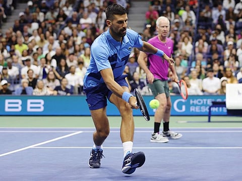 Former professional tennis player John McEnroe of the United States and Novak Djokovic of Serbia play against former professional tennis player Andre Agassi of the United States and Carlos Alcaraz of Spain during the Stars of the Open exhibition match at USTA Billie Jean King National Tennis Center on Wednesday.