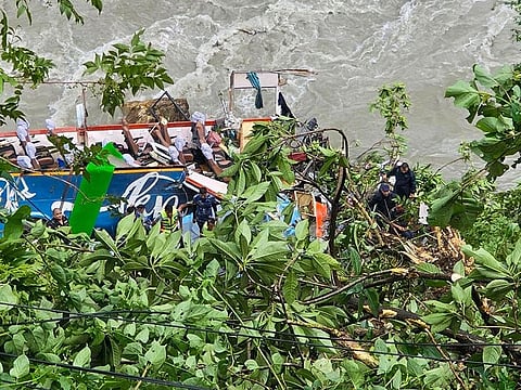 Rescue personnel gather at the site after a bus carrying Indian passengers plunged into the Marsyangdi river in Nepal's Tanahun district on August 23, 2024. 