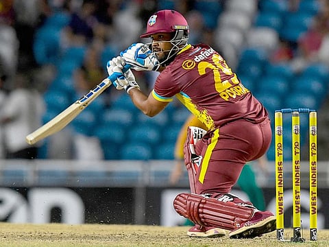 Nicholas Pooran of West Indies hits a boundary during the 1st T20I match against South Africa at Brian Lara Cricket Academy Stadium in Tarouba, San Fernando, Trinidad and Tobago, on August 23, 2024. 