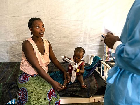 A woman discusses a treatment plan for her child with a health worker at the Munigi mpox treatment center in Nyiragongo territory, North Kivu, Democratic Republic of Congo.