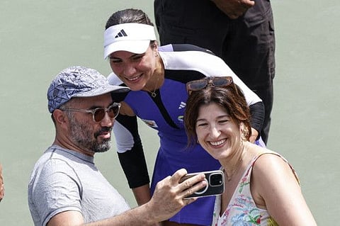 Romania's Elena-Gabriela Ruse poses for a photo with fans after defeating Czech Republic's Barbora Krejcikova during their women's singles second round tennis match on day three of the US Open tennis tournament at the USTA Billie Jean King National Tennis Center in New York City, on Wednesday.