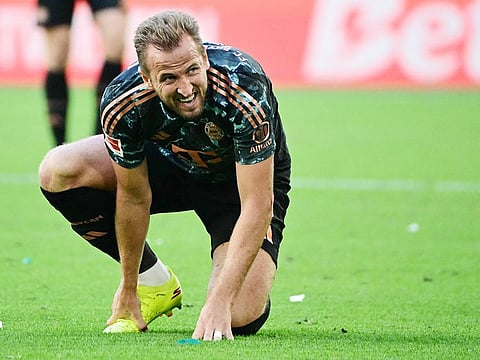 Bayern Munich's Harry Kane reacts during the German first division Bundesliga football match between VfL Wolfsburg and FC Bayern Munich in Wolfsburg, northern Germany, on August 25, 2024. 