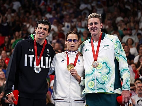 (From left) Silver medalist Italy's Simone Barlaam, gold medalist France's Ugo Didier and bronze medalist Australian Brenden Hall celebrate on the podium of the men's S9 400m freestyle swimming event during the Paris 2024 Paralympic Games at The Paris La Defense Arena in Nanterre, west of Paris on Thursday.