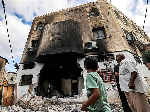 People inspect damage to a mosque building following an Israeli military operation in the Fara camp for Palestinian refugees near Tubas in the north of the occupied West Bank on August 29, 2024.  