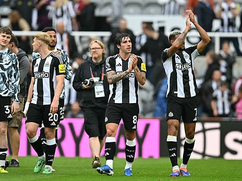 Newcastle United's Italian midfielder Sandro Tonali (centre) and teammates applaud supporters on the pitch after the English Premier League football match against Tottenham Hotspur at St James' Park in Newcastle-upon-Tyne, north east England on Sunday.