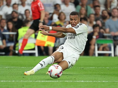 Real Madrid's French forward #09 Kylian Mbappe shoots the ball during the Spanish league football match between Real Real Madrid CF and Real Betis at the Santiago Bernabeu stadium in Madrid on September 1, 2024.