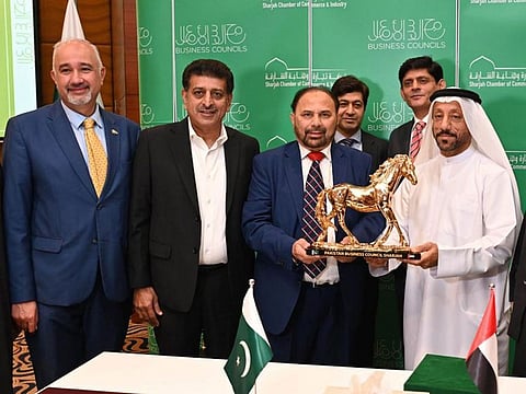 Abdallah Sultan Al Owais, Chairman of the SCCI (R) Syed Muhamed Tahir (2nd R) and Ambassador Faisal Niaz Tirmizi (L) during the launching ceremony Pakistan Business Council in Sharjah on Tuesday.