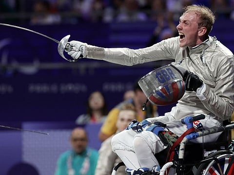 Britain's Piers Gilliver celebrates his victory after defeating Ukraine's Artem Manco during the semi-final wheelchair fencing men's Sabre Category A during the Paris 2024 Paralympic Games at the Grand Palais, in Paris, on Tuesday.