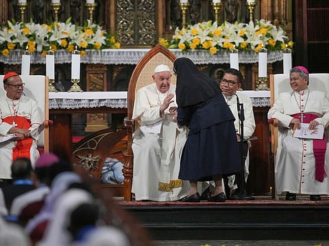 Pope Francis speaks with a nun at the Jakarta Cathedral on September 4, 2024.  