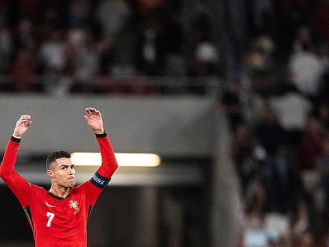 Cristiano Ronaldo celebrates his goal against Scotland