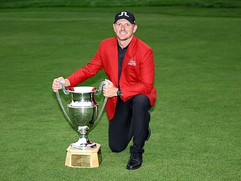 Matt Wallace poses with the Omega European Masters trophy